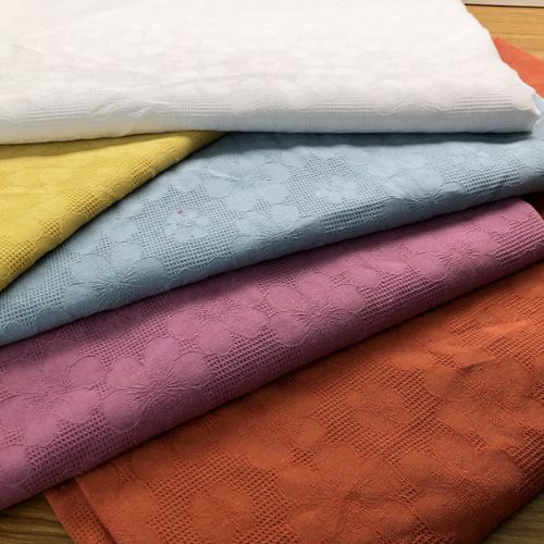Premium jacquard quilted fabric with a soft and elegant textured finish