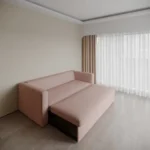 Modern fold sofa cum bed in a stylish living room.