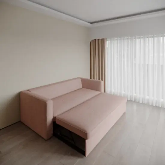 Modern fold sofa cum bed in a stylish living room.